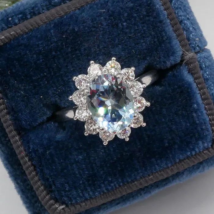 deBebians Oval Aquamarine and Diamond Halo Engagement Ring Rings