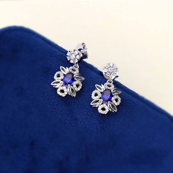 Flower Halo Simulated Blue Sapphire CZ Set in Sterling Silver BERRICLE Rings
