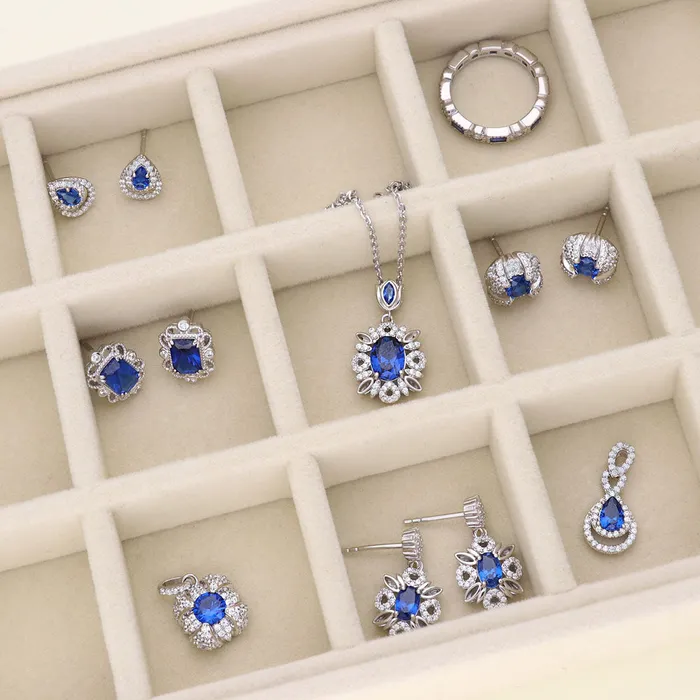 Flower Halo Simulated Blue Sapphire CZ Set in Sterling Silver BERRICLE Rings