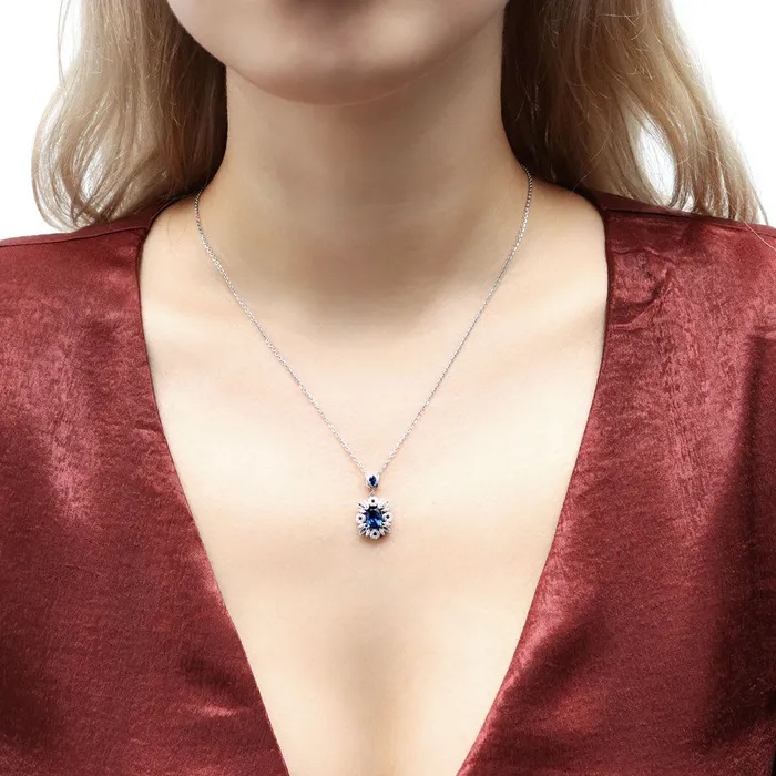 Flower Halo Simulated Blue Sapphire CZ Set in Sterling Silver BERRICLE Rings