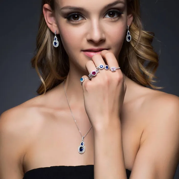 Halo Simulated Blue Sapphire Oval CZ Necklace in Sterling Silver BERRICLE Necklaces