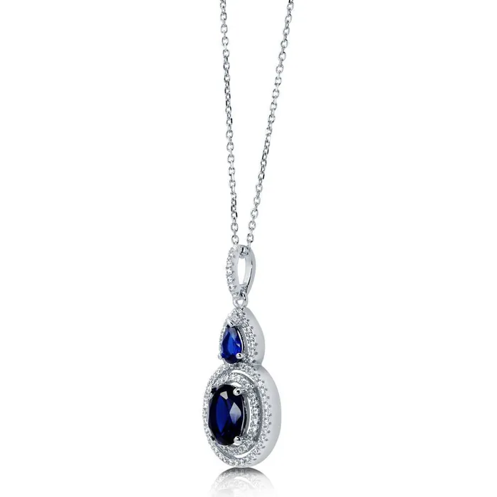 Halo Simulated Blue Sapphire Oval CZ Necklace in Sterling Silver BERRICLE Necklaces