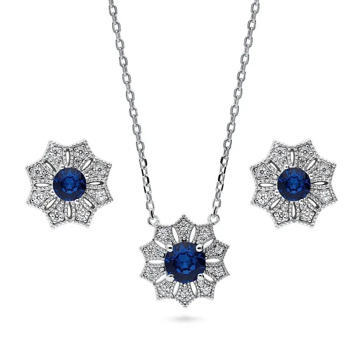 Rings Halo Flower Blue CZ Set in Sterling Silver BERRICLE
