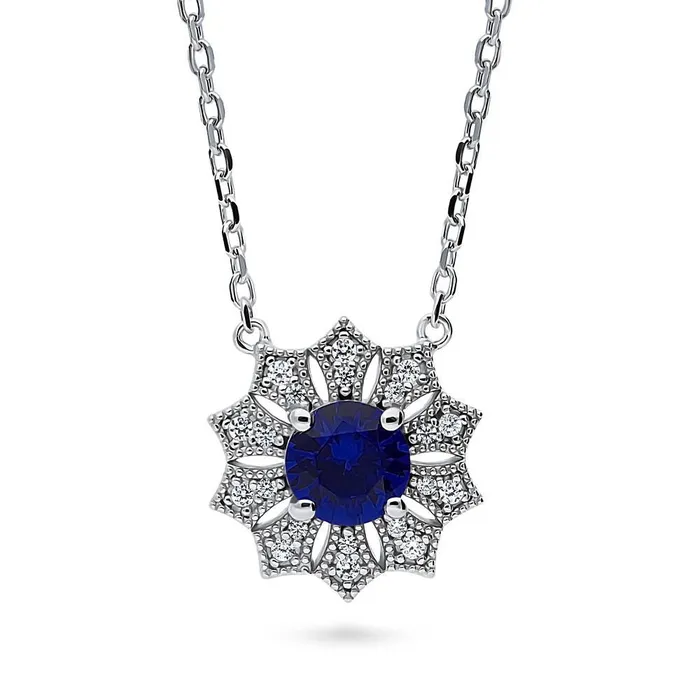 Rings Halo Flower Blue CZ Set in Sterling Silver BERRICLE